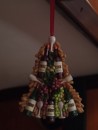 A small "tree" decorated with wine bottles hangs from a grab bar in the dinette area. (Radio Flyer Christmas décor, Rivers Edge Marina, St. Augustine, Florida)