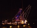 Lights glimmer from seasonally decorated boats down the dock. (Rivers Edge Marina, St. Augustine FL)