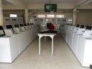 Laundromat interior. This is where I wash clothes once a week after hauling them on a luggage cart for a mile. 