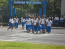 Youngsters in their lava lava uniforms exiting Samoana High School, a public high school in Utulei.
