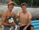 Chad (left) and Bret on Broken Compass with their husky Makai.