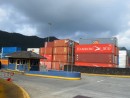 Containers are stacked four-high by the security gate to the Pago Pago Container Port.