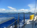 Tutuila, the main island of American Samoa, comes into view from the port deck.