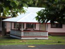 The covered gazebo-like structure in this front yard serves as the final resting place for honored relatives of the household. Many such structures grace the front yards of homes on Tutuila. (For photos of other grave sites in American Samoa and other Pacific Islands, see sub album "Cemeteries of the South Pacific" in the "Hiva Oa & Fatu Hiva" album.) 