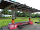 Many bus stops have covered seats. All are painted and individually decorated. This one is in Nuuuli. 