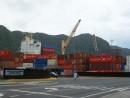 Large cranes load and unload containers from ships at the container port in Fagatogo.