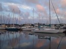 Pink clouds float above docked vessels at Rivers Edge Marina by Hurricane Pattys.