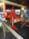 Back around the corner of the deck to the restaurant entrance, we are greeted by a giant, welcoming lobster.