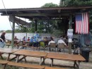 July Fourth, and Old Glory hangs from the pavilion rafter at Rivers Edge in honor of the holiday and another potluck barbecue. (Rivers Edge Marina, St. Augustine, Florida) 