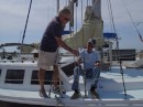 Jim (left) helps Don, owner of The Boat Shop at Rivers Edge Marina, with the rigging on the sailing vessel Plum Krazy.