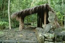 Recreation of a Taipi home built atop a pae pae (foundation of large, flat stones) with thatch roof. The open walls would have been hung with tapa cloth.