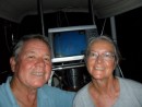 Crossing the equator -- Jim and Ann in the cockpit with the chart plotter in the background around 7:00 p.m. local time, 29 May 2010. (No, there was no one else on board with us; this is a self portrait.)