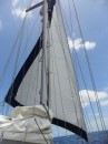 Sailing under the genoa on a bright, clear day in the South Seas.