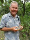 Jim holding a noni fruit, which grows wild in Nuku Hiva and is used to make the currently popular noni juice in America. Marc says the noni fruit does have medicinal benefits and was one of the many native fruits his grandmother used for healing.