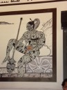 Painting of a Taipi warrior on the wall at "Alice