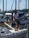 Mike steadies the mast as she goes down. (Rivers Edge Marina, St. Augustine FL)