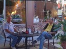 From left: Jim and Sam sit outside at our sidewalk table and chat as they await breakfast. (Aviles St., Historic St. Augustine FL)