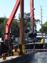 In mid-October the dredging barge is in the marina dredging deeper slips up by the sea wall. (Rivers Edge Marina, St. Augustine, Florida) 