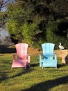 His & Hers chairs decorate the rear lawn.