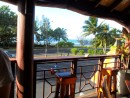 View of palm trees and the sea from the upstairs bar at High Tide. 