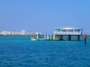 As we sail into Biscayne Bay, we pass through "Stiltsville," where houses built on stilts loom above the water.