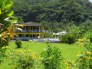 We turn off the coast road toward Tafuna at the intersection marked by this big yellow house.