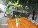 Live plants and fresh flowers adorn tables and entrance areas.