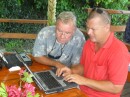Jim (left) and Hugo (Hasta Manana) take advantage of the free internet offered by the Aquarium to get some work done on their computers.