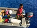 Young John, a son of Ed, prepares to help take the cargo we brought back with them to the island.  