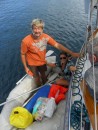 Anatoli and Natasha (Puppy) stop by in their dinghy to say goodbye before they leave the harbor.