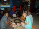 Ann partakes of the kava as local musicians look on at Aquarium Cafe.