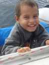 Mateo, who will be four years old in August, graces us with one of his most cheerful grins. (Ah, we feel better already.)