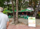James takes us to an open-air restaurant in a garden setting beneath the palms, just far enough away from the noise and bustle of the main drag in Puerto Plata but still facing the malecon and the sea beyond. (Puerta Plata, Dominican Republic)