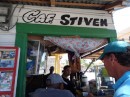 Charlie (right) gets in line to order a café con leche (coffee with milk) at Café Stiven in the open air market, Barahona, Dominican Republic.  