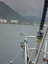 Our bow pulpit fills the foreground as we approach Apia.