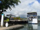 The Moana Blue floating restaurant and its covered picnic table nearby where Rudi awaited us following our interminable clearing in process.