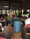 A Samoan drummer sets the beat while dancers rehearse on the stage in the open-air restaurant/bar area of Aggie Greys.