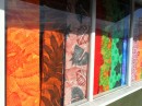 Colorful fabrics fill the windows of shops downtown.