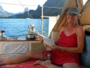 Ann relaxes in cockpit with Moorea