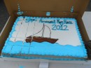 A giant cake with nautical theme tops off the feast.