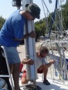 Matt (left) assists in making sure the mast comes down in the right place.