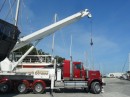 One of our main jobs to accomplish while hauled out is the pulling of the mast so that Jim can run new wiring through it. Fortunately, Grace Crane Services has just the truck to do the job.