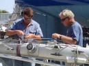 Jim observes as Dan of Grace Crane Services (left) prepares the mast to be raised.