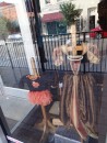 Halloween is approaching, as evidenced by the costumes displayed in this shop window. (Downtown Wake Forest)