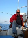 Capt. Jim relaxes by the helm after leaving the harbor at Ensenada. Adios, Mexico!