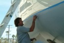 After more than a year on the hard, Tuwawi is nearing launch date as Capt. Tom works on some finishing touches.