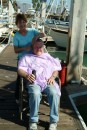 Jim gets a professional hair cut on the dock by Mexican stylit Susana from the schooner Gold Eagle.