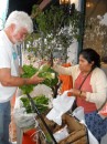 Frank buys fresh veggies from the vegetable lady in front of La Vendimia.