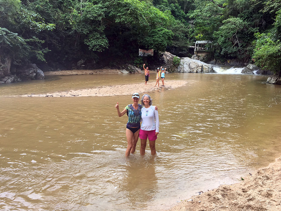Christine and Heidi fording the river on the way to Quimixto Waterfalls (the falls in the background are the small falls, not the end of the trail yet.) Juan, Rachel, and Lisa on the sandbar. 