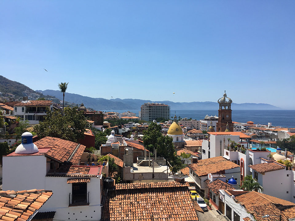 Puerto Vallarta is full of hills (kinda like Seattle and San Francisco) and the views from the hilltops are breathtaking! This is the view from the top of a Lighthouse tower over looking downtown and the Cathedral of Guadeloupe wearing her crown. You can also see a parasailor in the sky along with some frigate birds!